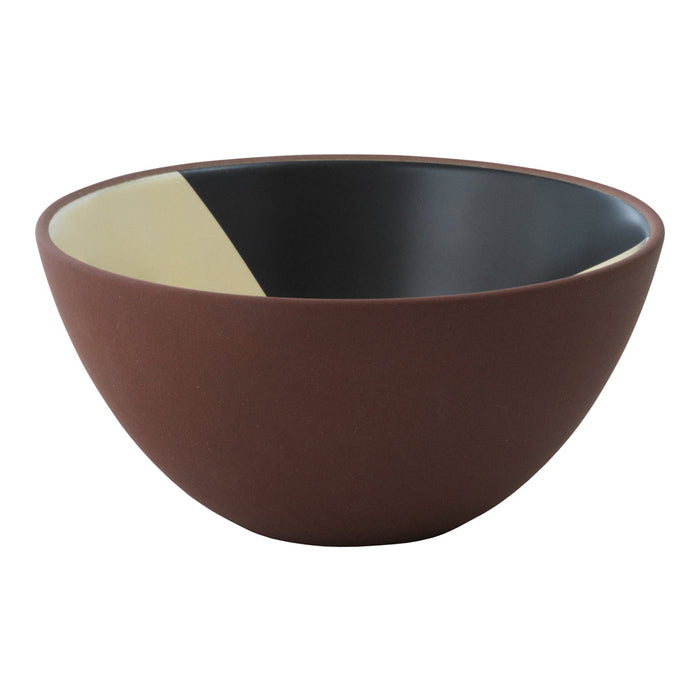 Brown ceramic bowl with a two-tone interior: matte black and a contrasting pale yellow geometric pattern.