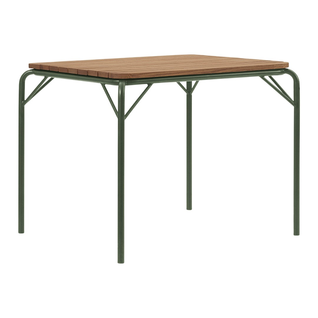 Wooden tabletop in warm brown with green metal legs, featuring a simple, modern design. Perfect for outdoor settings.