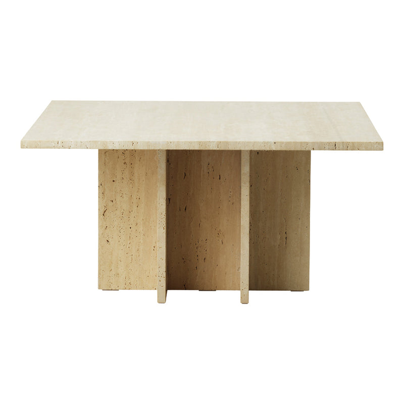 Light beige travertine dining table with smooth surface and minimalist design, featuring a natural textured finish.