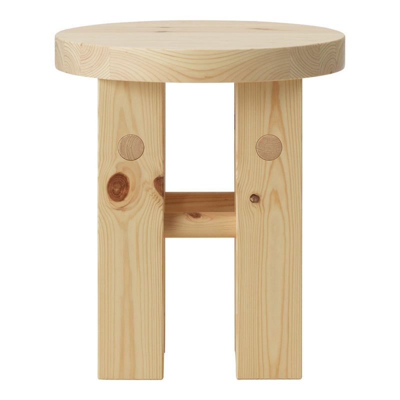Natural wood stool with a light pine finish and simple, unadorned patterns for a minimalist look.