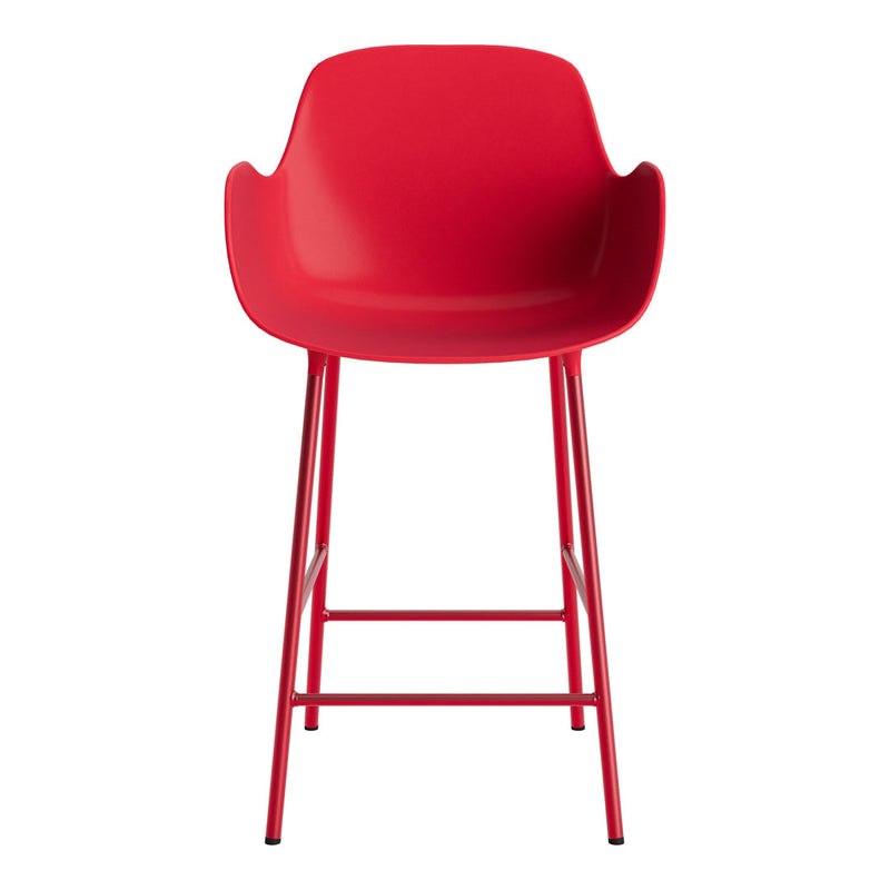 Bright red bar stool with smooth, minimalist design and sleek metal legs. Perfect for modern decor.