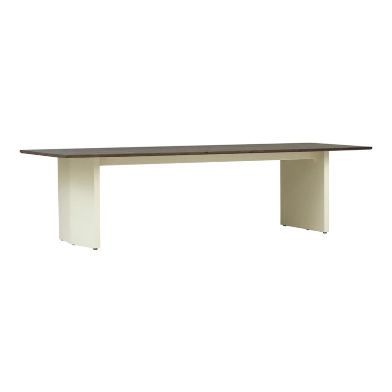Modern dining table with a dark wood top and cream-colored legs, featuring a sleek and minimalist design.