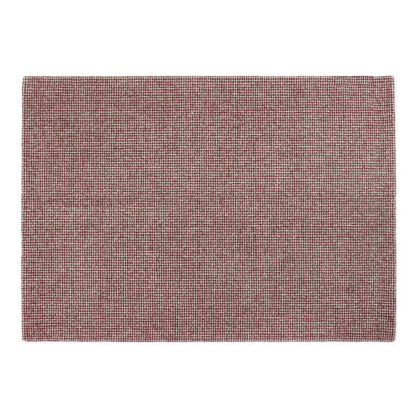Soft burgundy rug with a textured weave, perfect for adding warmth to any space. Elegant and versatile home decor piece.