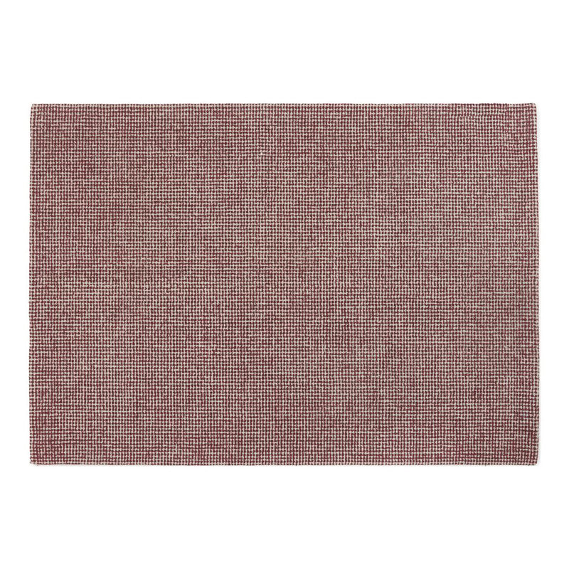 Soft burgundy rug with a textured weave, perfect for adding warmth to any space. Elegant and versatile home decor piece.