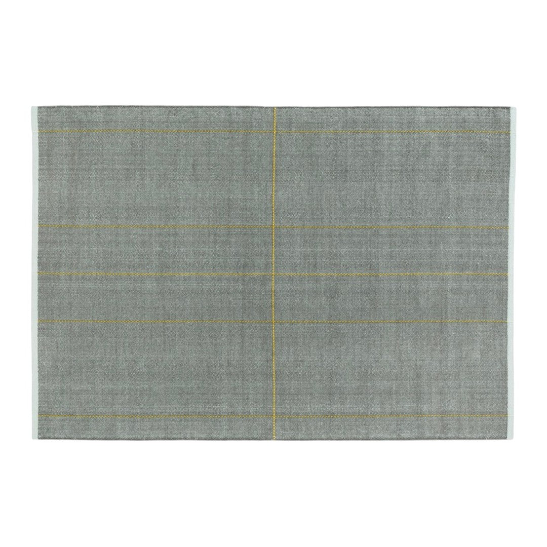 Gray placemat with subtle checkered pattern and yellow accent lines for a modern dining aesthetic.