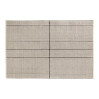 Textured beige rug with subtle black grid pattern, perfect for modern home décor.
