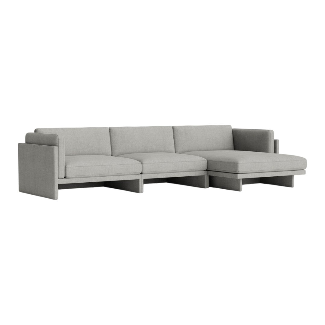 Light gray sectional sofa with a sleek design and soft, textured fabric. Modern and versatile for any living space.