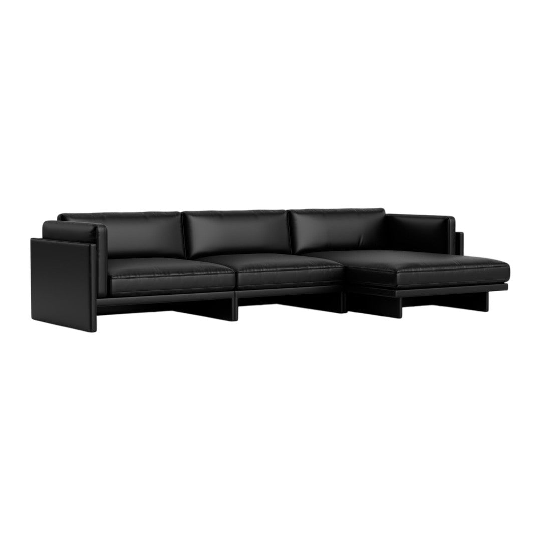 Black leather sectional sofa with smooth texture and sleek lines, perfect for modern living spaces.