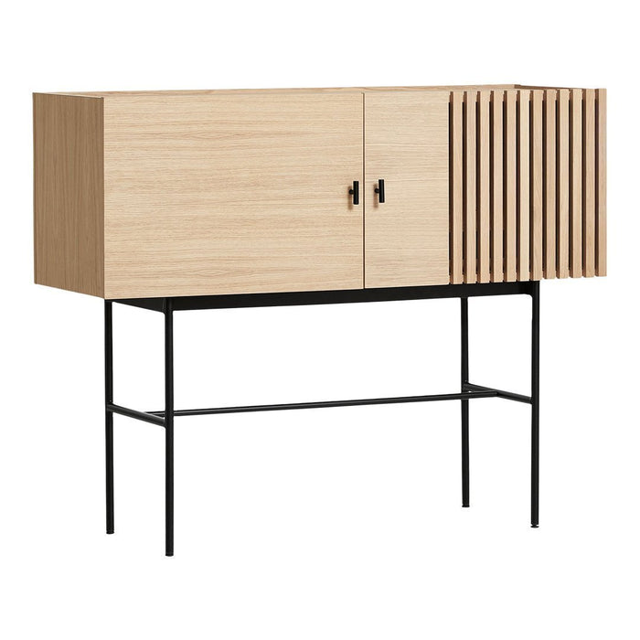 Light oak wooden cabinet with vertical slatted design, featuring a sleek black metal frame for a modern touch.