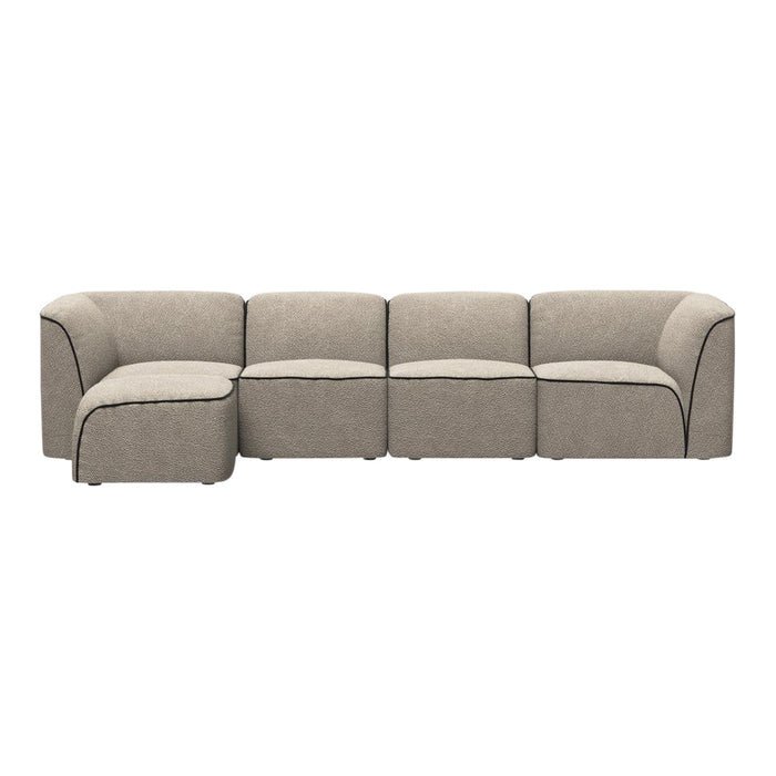 Beige sectional sofa with black piping and a soft, textured fabric, featuring a modern, clean-lined design.