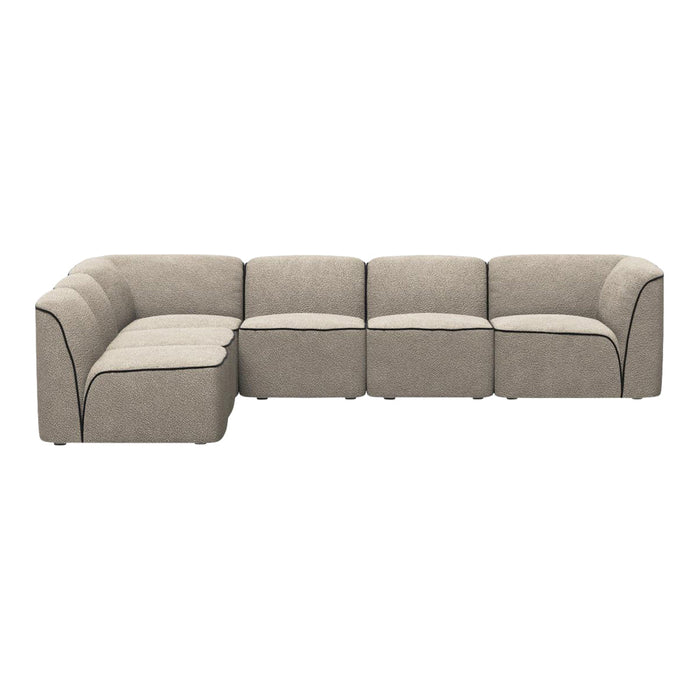 Stylish modular sectional sofa in soft beige fabric with contrasting black piping details.