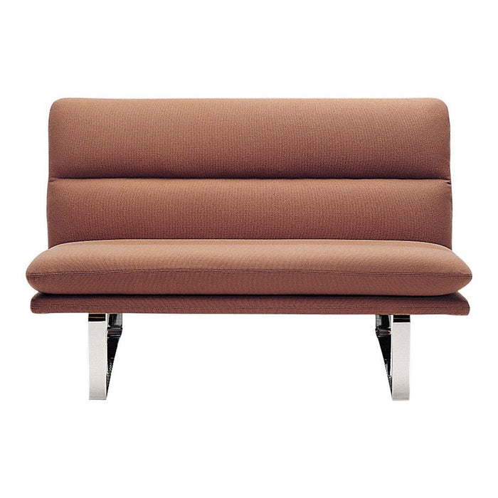 Brown upholstered loveseat with sleek chrome legs and a minimalist design, featuring smooth, modern lines.