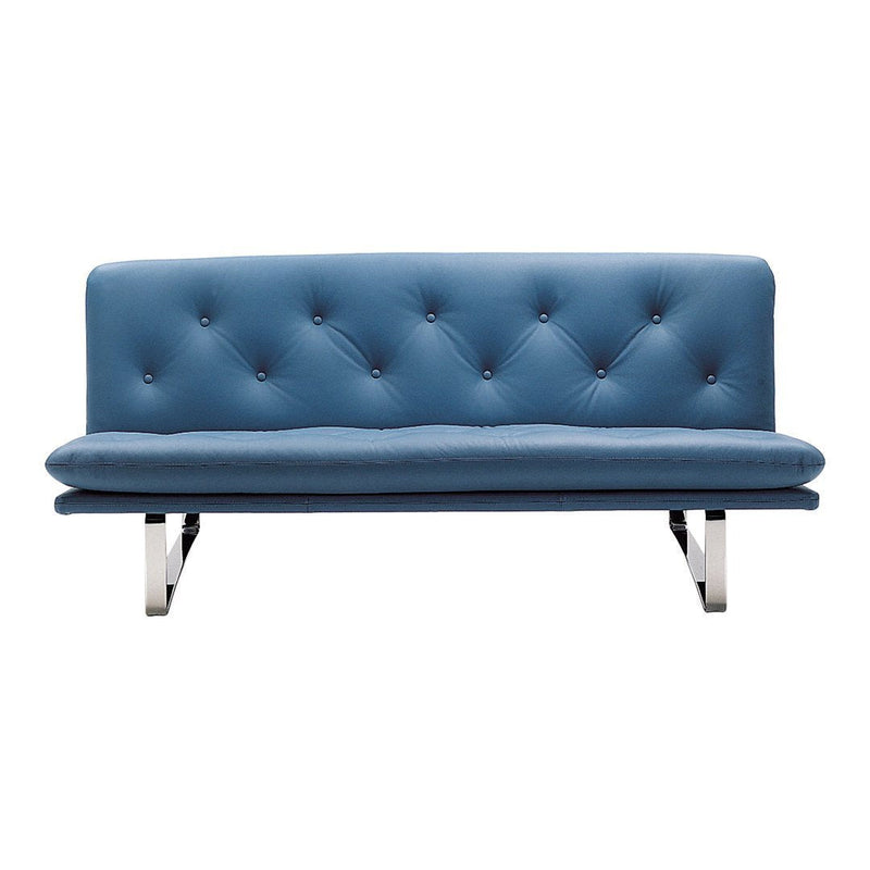 Blue tufted sofa with a sleek design and shiny metal legs, featuring a minimalist pattern for modern decor.