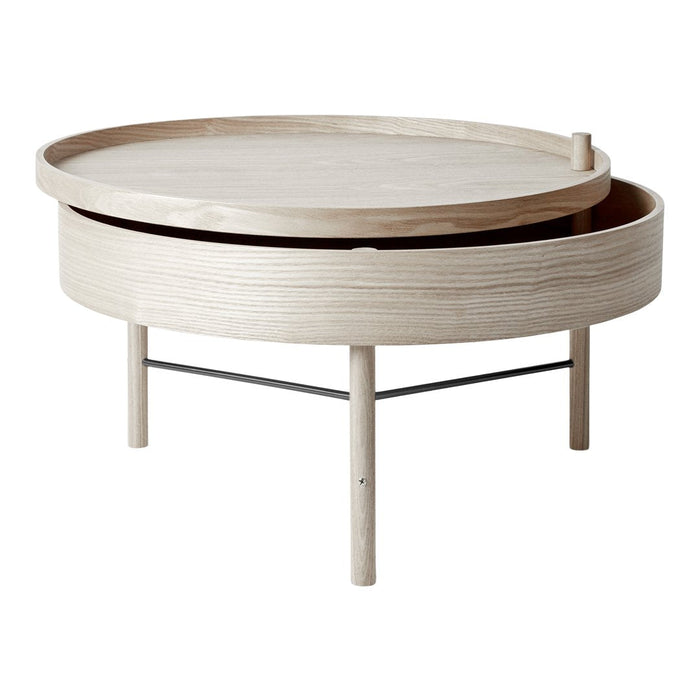 Light ash wood round coffee table with a smooth, pale finish and subtle grain patterns, featuring sleek metal accents.