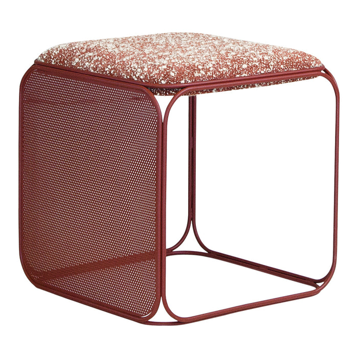 Square side table with a textured, warm red cushion and a matching red metal frame featuring a perforated design.
