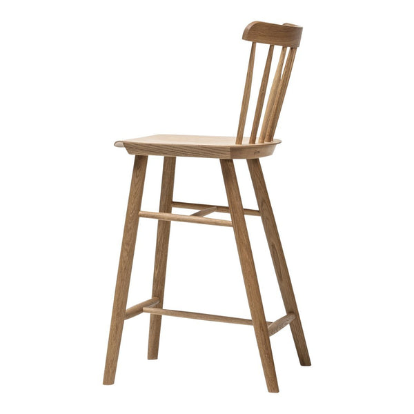Natural wood bar stool in light brown with a minimalist design and slatted back for a classic touch.