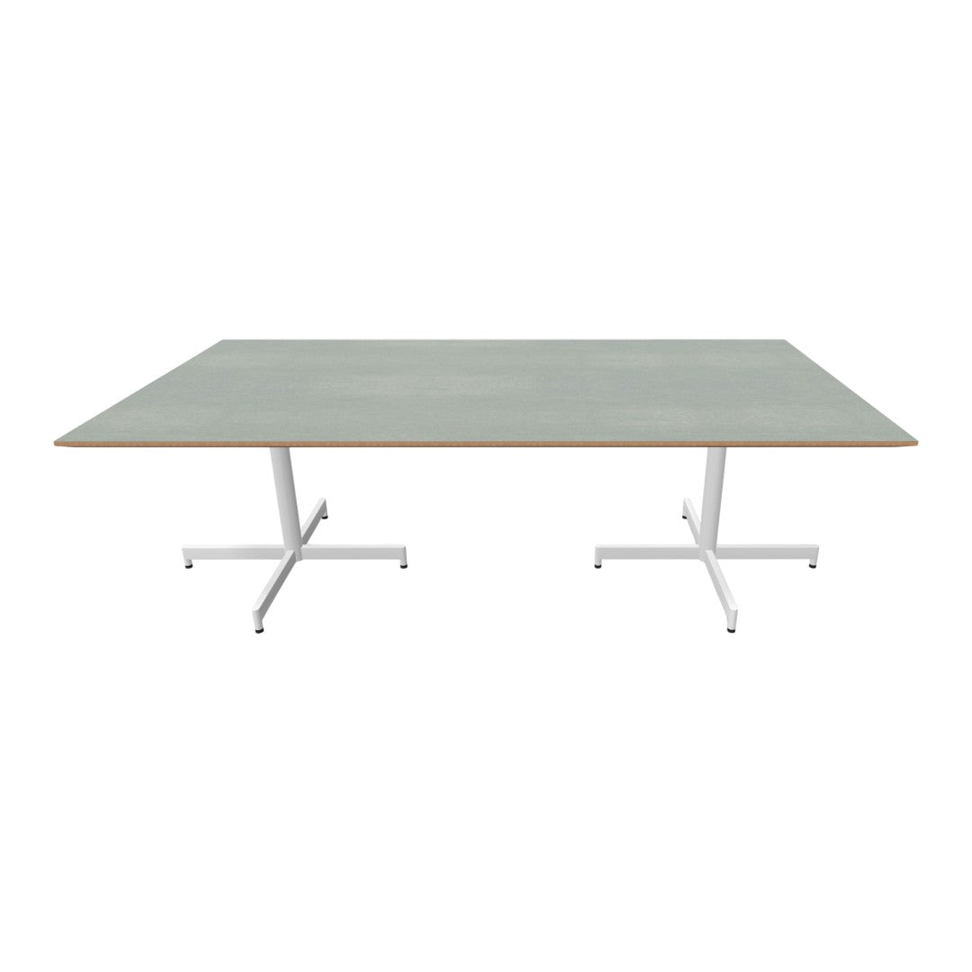 Green tabletop with a wood grain edge, supported by a sleek white metal base, minimalistic design.