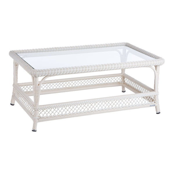 White wicker coffee table with a clear glass top, featuring a woven pattern and a sleek, modern design.