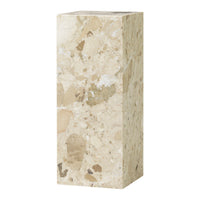 Light beige marble pedestal with varying speckles and patterns for a natural stone finish.