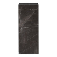 Sleek black marble pedestal with striking white veining pattern, perfect for elegant home decor.