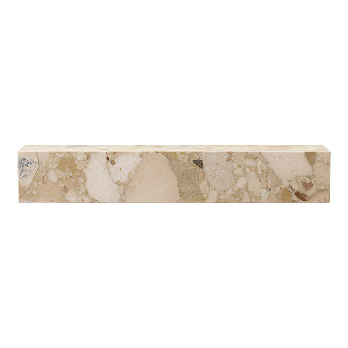 Beige stone block with light and dark speckles, showcasing a natural, earthy pattern ideal for various decor styles.
