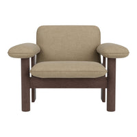 Beige upholstered armchair with brown wooden frame and rounded armrests, featuring a minimalist design.