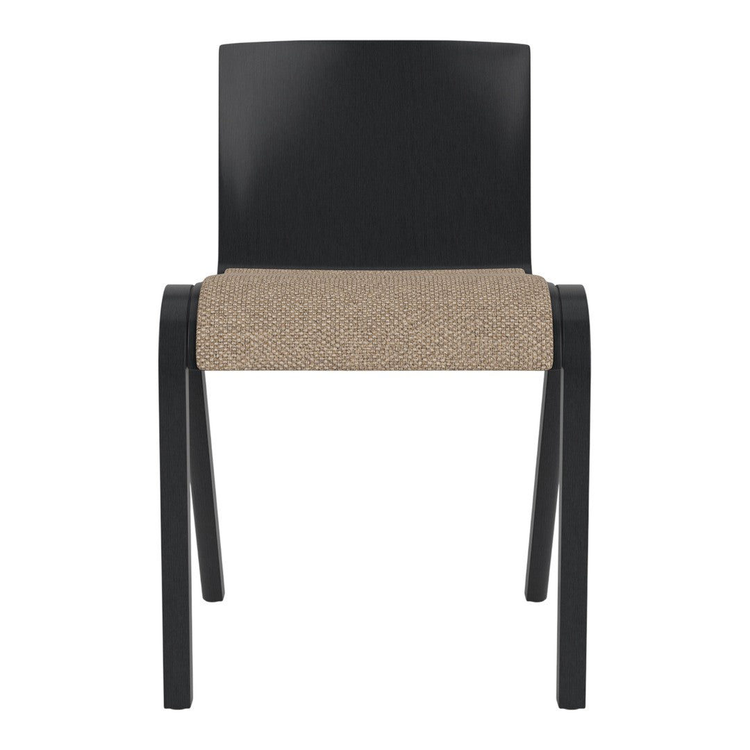Black wooden chair with a textured beige seat in a minimalist design. Perfect for modern interiors.
