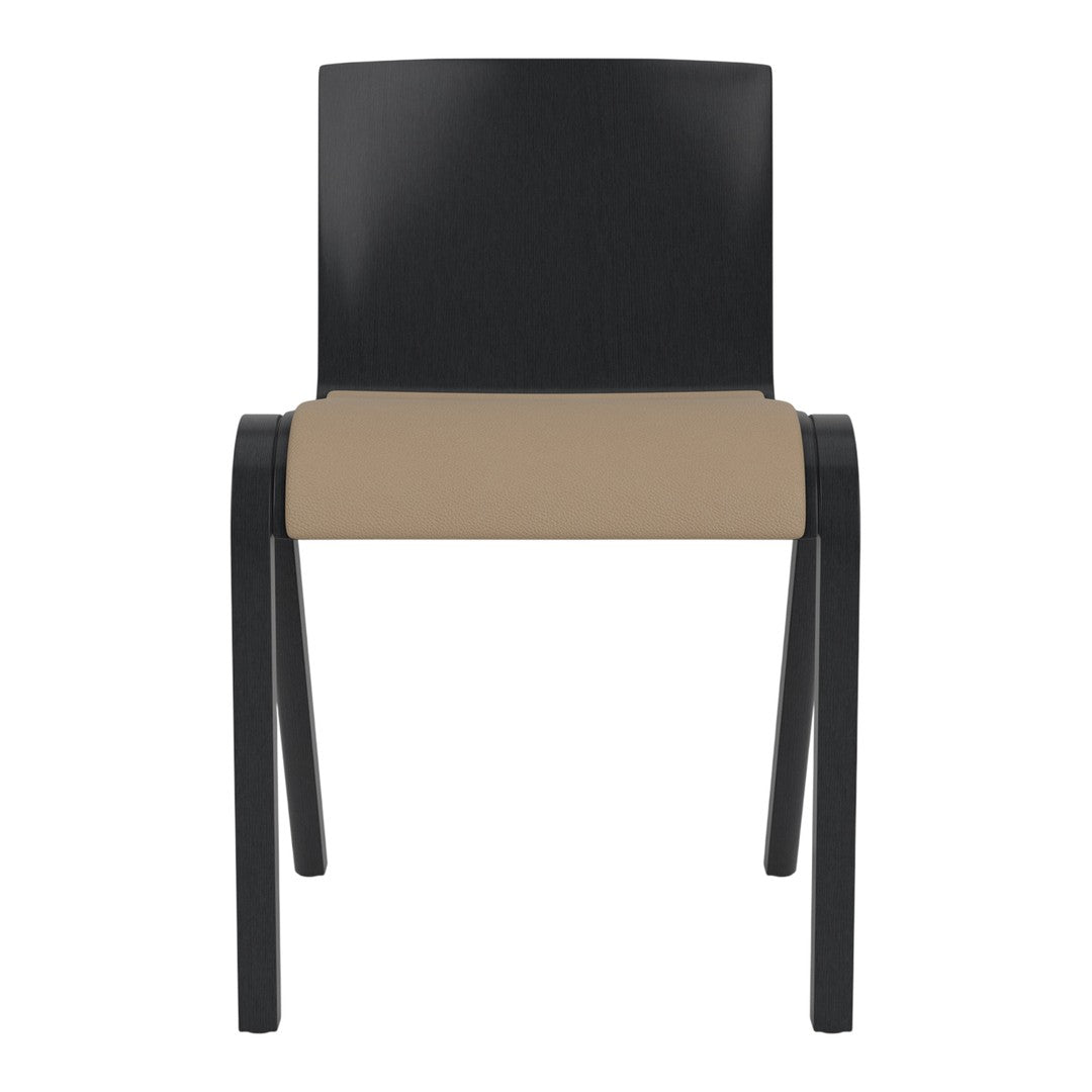 Black wooden chair with a smooth beige seat cushion, featuring a minimalist design.