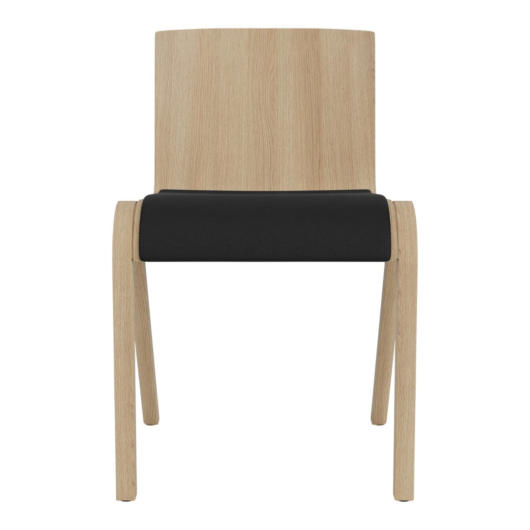 Natural wood chair with a light oak finish and a sleek black cushion seat. Simple, modern design.