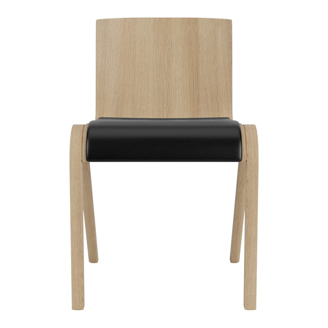 Light wood chair with a sleek black seat, featuring a modern minimalist design and clean lines.
