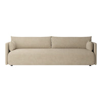 Beige fabric sofa with smooth upholstery and rounded cushions, ideal for modern living spaces.
