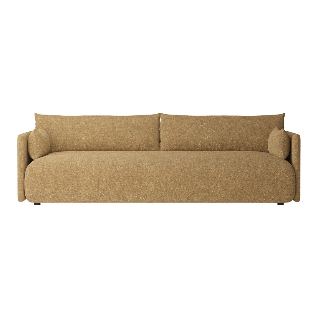 Tan fabric sofa with smooth texture, featuring simple, modern lines and round cushions for added comfort.