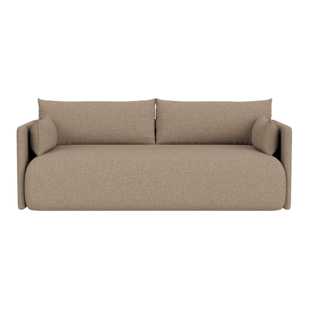 Beige upholstered sofa with minimalist design and soft, textured fabric. Perfect for modern living spaces.