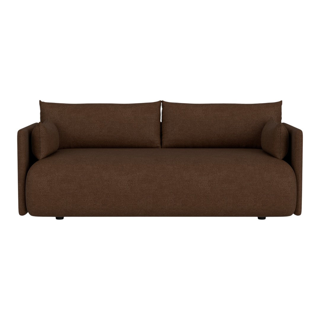 Brown upholstered sofa with a smooth texture and modern design, featuring round armrests and removable cushions.