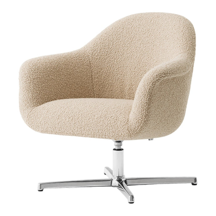 Beige boucle fabric armchair with a sleek chrome base and modern design. Perfect for stylish, contemporary decor.
