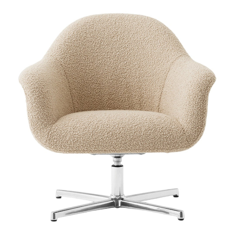 Cream-colored boucle chair with soft texture and sleek chrome base, offering a modern aesthetic for stylish interiors.