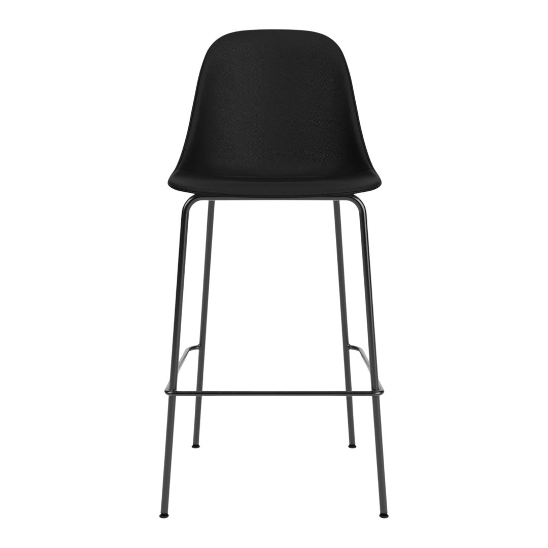 Black modern barstool with a sleek molded seat and minimalist metal frame. Perfect for contemporary interiors.