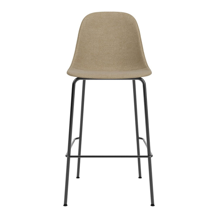 Neutral beige bar stool with a smooth, solid seat and sleek black metal legs. Modern, minimalist design.