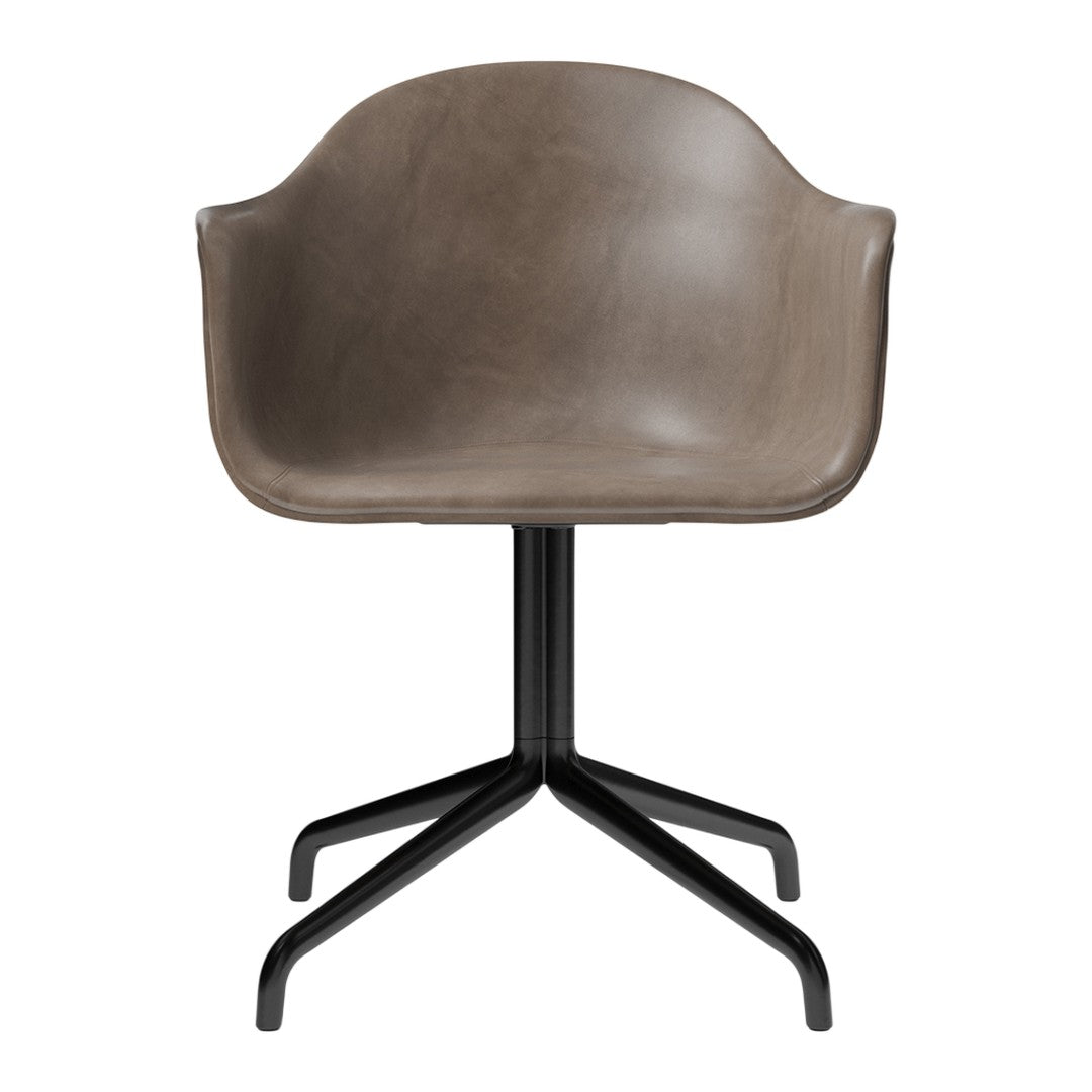 Gray molded chair with smooth finish and black metal base, featuring a minimalist design. Ideal for modern decor.