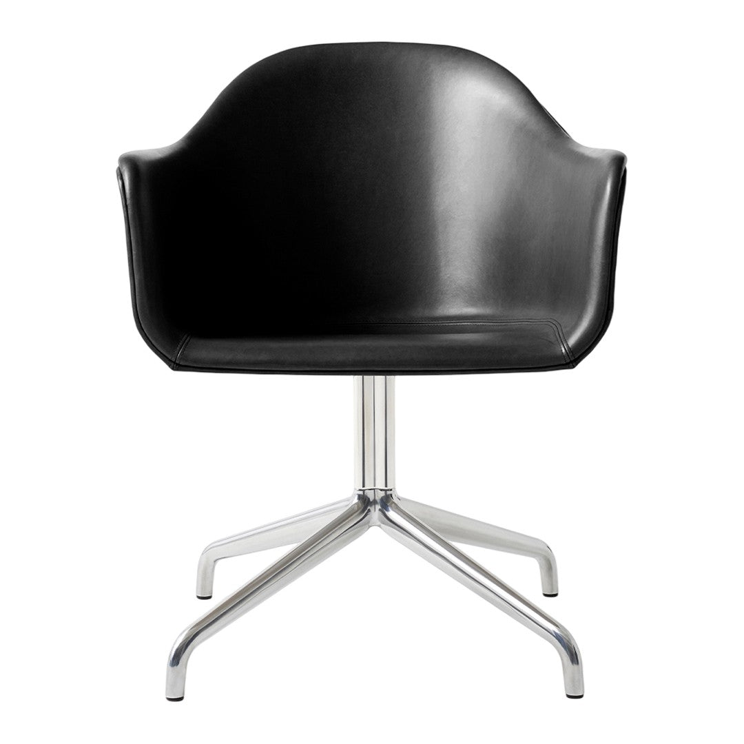 Black molded chair with sleek chrome base, featuring a minimalist design for modern decor.