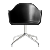 Black molded chair with sleek chrome base, featuring a minimalist design for modern decor.