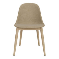 Beige dining chair with a smooth, curved seat and light wooden legs, featuring a minimalist design.