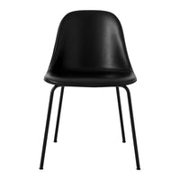 Black plastic dining chair with sleek, minimalist design and metal legs. Perfect for modern decor.