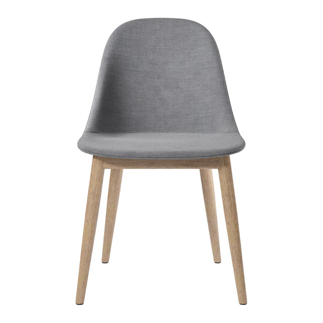 Grey upholstered chair with wooden legs, featuring a smooth and minimalist design. Perfect for modern decor.