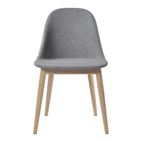 Grey upholstered chair with wooden legs, featuring a smooth and minimalist design. Perfect for modern decor.