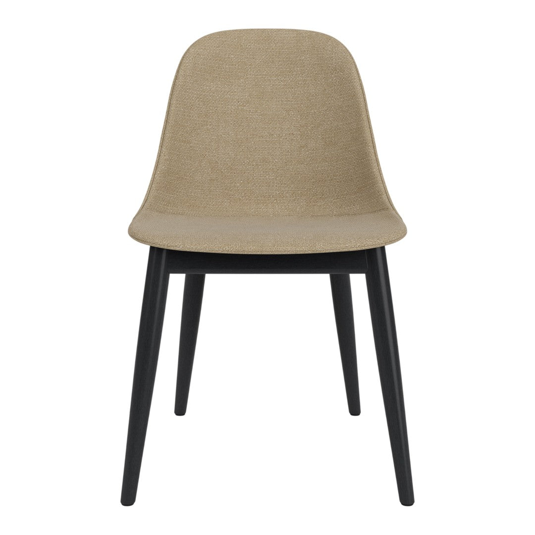 Beige fabric chair with sleek black wooden legs, featuring a minimalist design and smooth, clean lines.