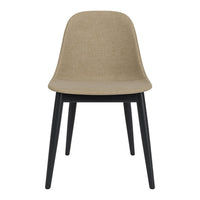 Beige fabric chair with sleek black wooden legs, featuring a minimalist design and smooth, clean lines.