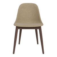 Beige upholstered chair with a sleek, minimalist design and dark wooden legs. Perfect for modern interiors.