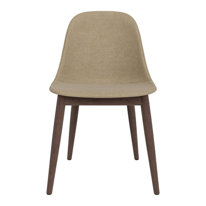 Beige upholstered chair with a sleek, minimalist design and dark wooden legs. Perfect for modern interiors.