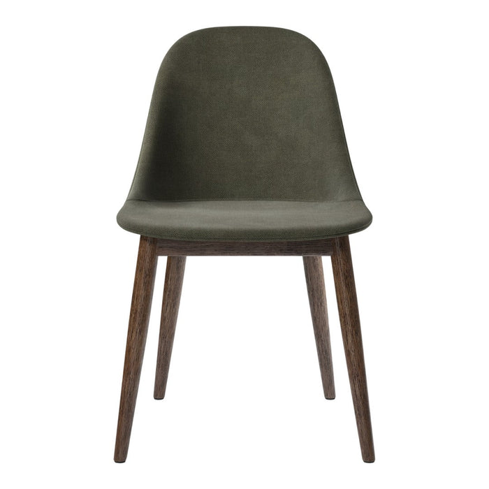 Green upholstered chair with smooth contours and wooden legs, featuring a modern, minimalist design.